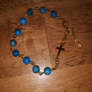 Beautiful blue handmade bracelet with cross
